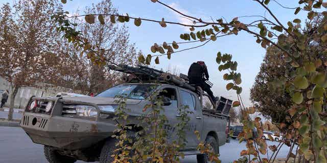 Taliban fighters near the site of an attack in Kabul, Afghanistan, on Dec. 2, 2022. A prominent politician and warlord, Gulbuddin Hekmatyar, also escaped unhurt in a separate attack in Kabul on Friday, his office said in a statement. The two attackers were killed by security guards.
