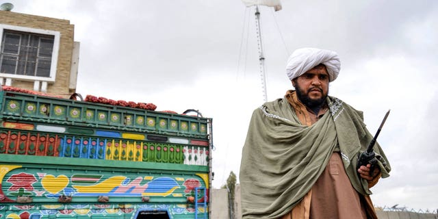 A Taliban security personnel stand guard at the Afghanistan-Pakistan border in Spin Boldak on December 12, 2022. 