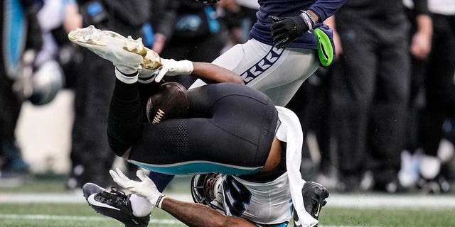 Carolina Panthers wide receiver Terrace Marshall Jr. (88) makes a catch with his legs against the Seattle Seahawks during the second half, Sunday, Dec. 11, 2022, in Seattle.
