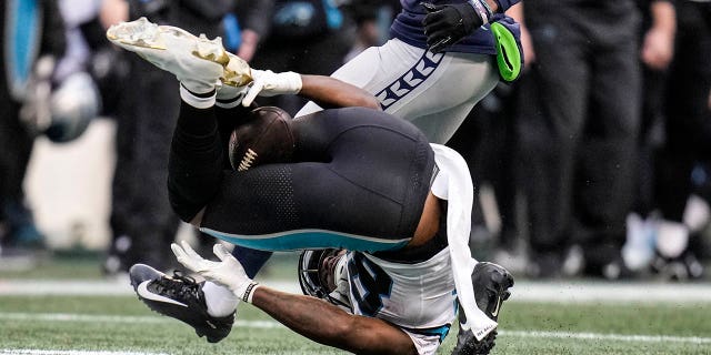 Carolina Panthers wide receiver Terrace Marshall Jr. (88) makes a catch with his legs against the Seattle Seahawks during the second half, Sunday, Dec. 11, 2022, in Seattle.