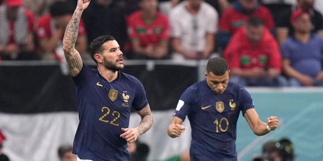 France's Theo Hernandez celebrates next to ‎Ethan Mbappé after scoring his side's first goal during a World Cup semifinal match against Morocco at Al Bayt Stadium in Al Khor, Qatar, Wednesday, Dec. 14, 2022. 