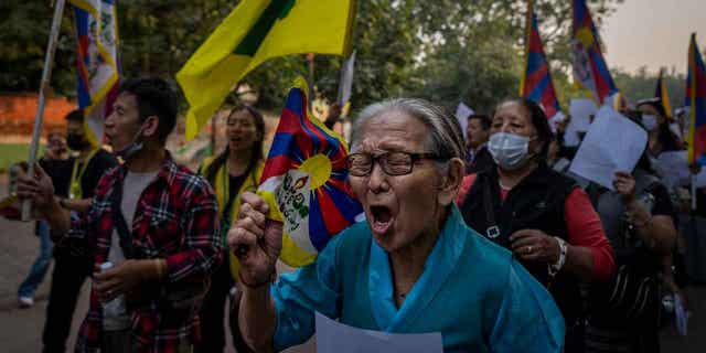 Exile Tibetan activists hold blank white papers symbolizing government censorship in China, during a protest in New Delhi, India, on Dec. 2, 2022. The protest was in solidarity with the "White Paper" protests against the Chinese government's continued zero-COVID policies. 