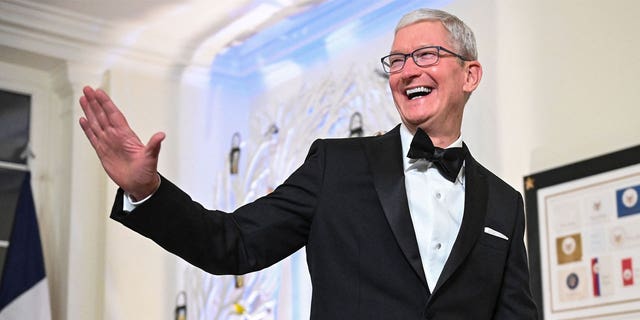 Apple CEO Tim Cook arrives at the White House to attend a state dinner honoring French President Emmanuel Macron on Dec. 1, 2022.