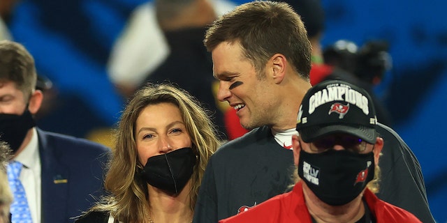 Tom Brady of the Buccaneers celebrates with Gisele Bundchen after winning Super Bowl LV at Raymond James Stadium on February 7, 2021 in Tampa, Florida.