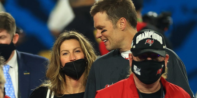 Tom Brady of the Buccaneers celebrates with Gisele Bundchen after winning Super Bowl LV at Raymond James Stadium on February 7, 2021 in Tampa, Florida.