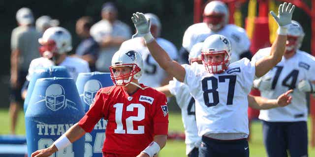 Tom Brady warming up at practice with future Hall of Fame tight end Rob "Gronk" Gronkowski.
