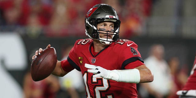 Tampa Bay Buccaneers quarterback Tom Brady (12) drops back to pass in the first half of an NFL football game against the New Orleans Saints in Tampa, Fla., Monday, Dec. 5, 2022. 