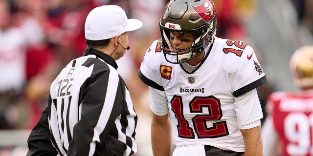 Tom Brady of the Tampa Bay Buccaneers has words with an official during the first half at Levi's Stadium on Dec. 11, 2022, in Santa Clara, California.