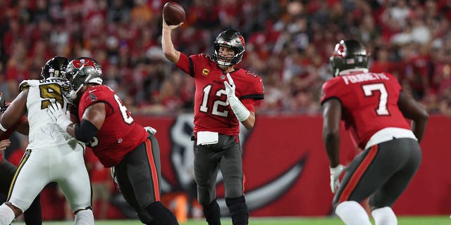 Tampa Bay Buccaneers quarterback Tom Brady (12) passes in the first half of an NFL football game against the New Orleans Saints in Tampa, Fla., Monday, Dec. 5, 2022. 