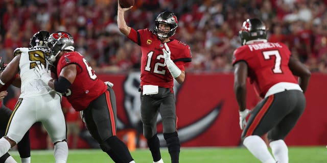 Tampa Bay Buccaneers quarterback Tom Brady (12) passes in the first half of an NFL football game against the New Orleans Saints in Tampa, Fla., Monday, Dec. 5, 2022.