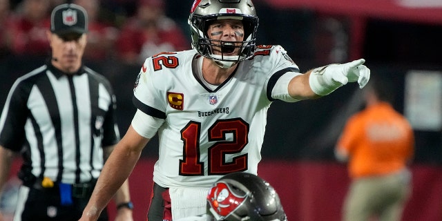 Tampa Bay Buccaneers quarterback Tom Brady (12) calls a play against the Arizona Cardinals during the second half of an NFL football game, Sunday, Dec. 25, 2022, in Glendale, Ariz. 