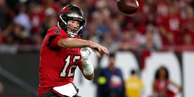 Tampa Bay Buccaneers quarterback Tom Brady (12) passes in the first half of an NFL football game against the New Orleans Saints in Tampa, Fla., Monday, Dec. 5, 2022.