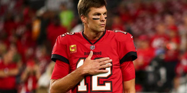 Tom Brady #12 of the Tampa Bay Buccaneers stretches prior to an NFL football game against the New Orleans Saints at Raymond James Stadium on December 5, 2022, in Tampa, Florida.