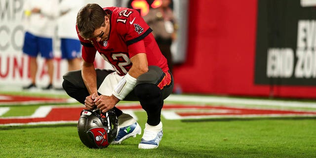 Tom Brady, #12 of the Tampa Bay Buccaneers, kneels in the end zone prior to an NFL football game against the New Orleans Saints at Raymond James Stadium on Dec. 5, 2022 in Tampa, Florida.