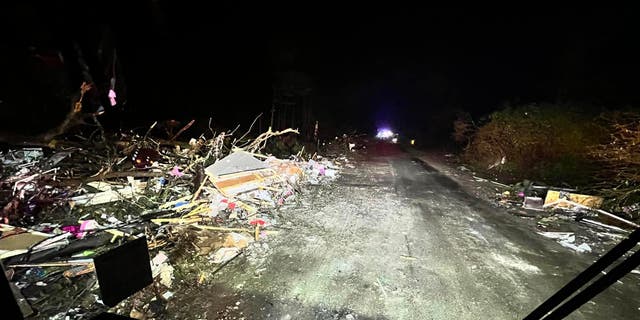 Significant damage in Keithsville, Louisiana, after a tornado tore through the town Tuesday, Dec. 13, 2022, killing an 8-year-old boy and sending first responders on a search for his mother.