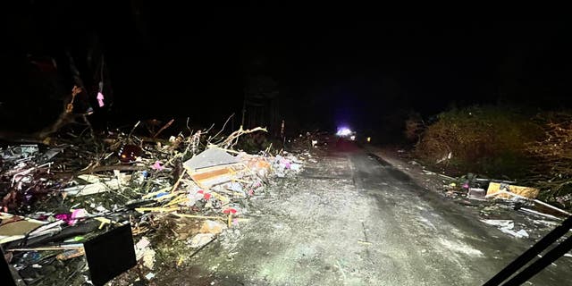 Significant damage in Keithsville, Louisiana, after a tornado tore through the town Tuesday, Dec. 13, 2022, killing an 8-year-old boy and sending first responders on a search for his mother.