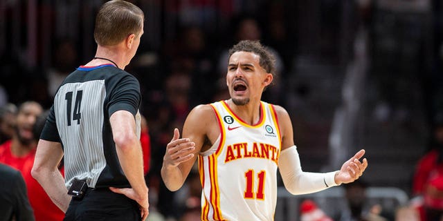 Atlanta Hawks guard Trae Young (11) yells at referee Ed Malloy during the second half, Sunday, Dec.  11, 2022, in Atlanta.