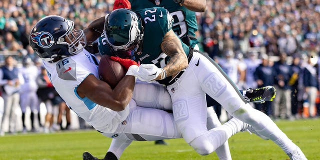 Tennessee Titans wide receiver Treylon Burks (16) is hit by Philadelphia Eagles safety Marcus Epps (22) as he makes a touchdown catch during the first quarter at Lincoln Financial Field in Philadelphia on Dec. 4, 2022.