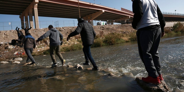 Migrants walk towards the U.S.-Mexico border in Ciudad Juarez, Mexico, Monday, Dec. 19, 2022.