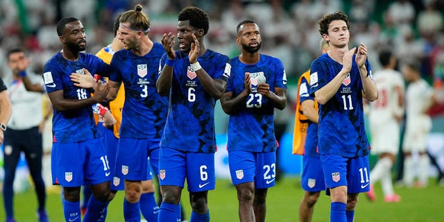 USA players celebrate their victory after the World Cup Group B match against Iran at Al Thumama Stadium, Nov. 29, 2022, in Doha, Qatar.