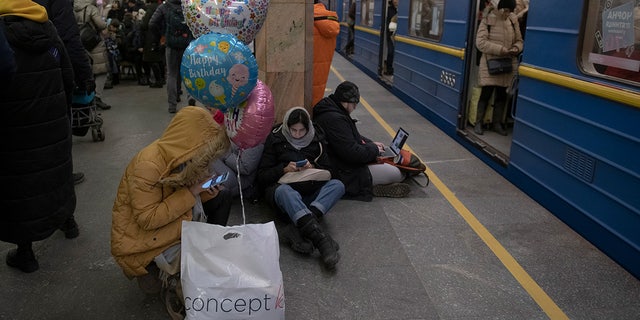 People rest in the subway station used as a bomb shelter during a rocket attack in Kiev, Ukraine, on Monday, Dec. 5, 2022. Ukraine's air force said it had shot down more than 60 of the roughly 70 missiles Russia fired at in its last barrage against Ukraine.  It was the latest assault as part of Moscow's new and intensified campaign that has largely targeted Ukraine's infrastructure and cut off electricity, water and heat supplies to the country as winter looms.