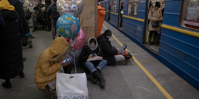 People rest in the subway station used as a bomb shelter during a rocket attack in Kiev, Ukraine, on Monday, Dec. 5, 2022. Ukraine's air force said it had shot down more than 60 of the roughly 70 missiles Russia fired at in its last barrage against Ukraine. It was the latest assault as part of Moscow's new and intensified campaign that has largely targeted Ukraine's infrastructure and cut off electricity, water and heat supplies to the country as winter looms.
