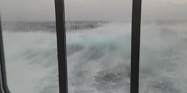 Waves are seen crashing alongside the Viking Polaris cruise ship during its recent voyage in the Drake Passage.