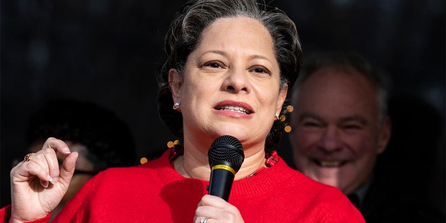 State Sen. Jennifer McClellan, D-Va., candidate for Virginia's 4th Congressional District, speaks during a canvassing event as Sen. Tim Kaine, D-Va., looks on, in the North Side of Richmond, Virginia, on Saturday, Dec. 17, 2022.