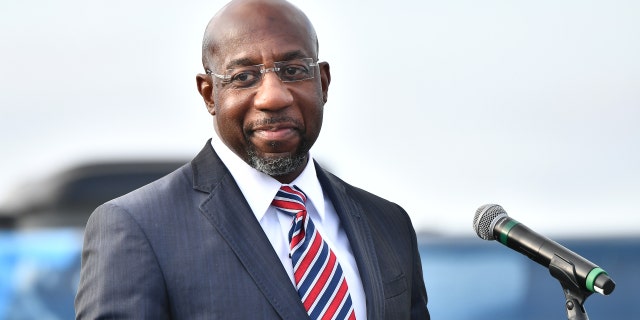 Raphael Warnock, then a Senate candidate, speaks during the "Vote GA Blue" concert on Dec. 28, 2020, in Stonecrest, Georgia.