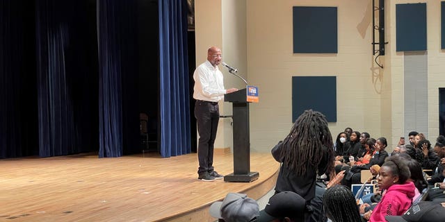 Sen. Raphael Warnock, D-Ga., speaks with students at Albany State University during a campaign stop Nov. 30, 2022.