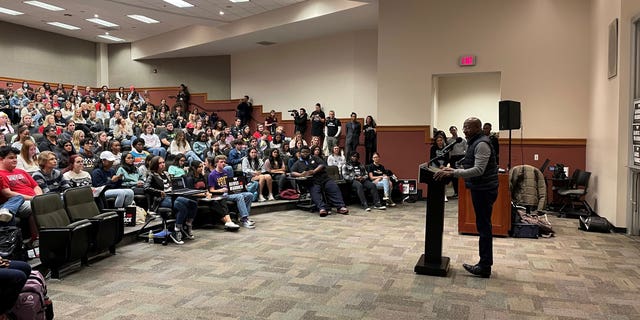 Democratic Georgia Sen. Raphael Warnock speaks with students at the University of Georgia on Dec. 4, 2022.