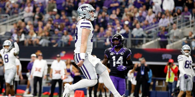 Quarterback Will Howard (18) of the Kansas State Wildcats scores a touchdown in the second quarter against the TCU Horned Frogs at AT and T Stadium Dec. 3, 2022, in Arlington, Texas.