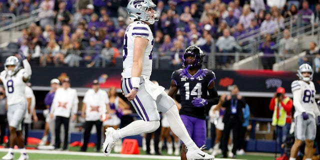 Quarterback Will Howard (18) of the Kansas State Wildcats scores a touchdown in the second quarter against the TCU Horned Frogs at AT and T Stadium Dec. 3, 2022, in Arlington, Texas.