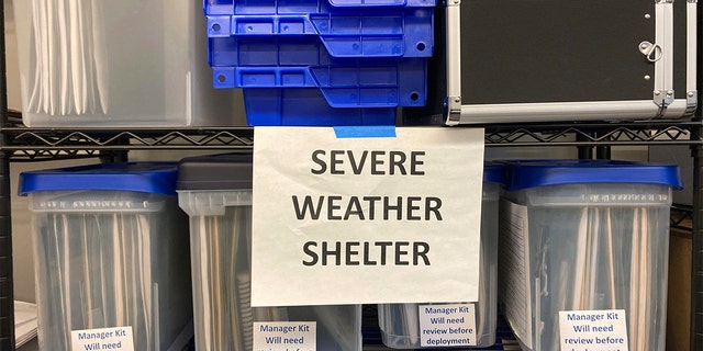 Plans for the activation of emergency severe weather shelters sit in bins at a warehouse in Portland, Oregon, on Wednesday, Dec. 21, 2022, as officials open four such shelters in advance of an unusually cold weather system and ice storm.
