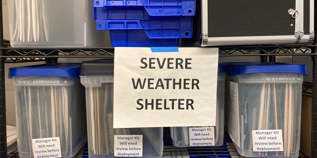 Plans for the activation of emergency severe weather shelters sit in bins at a warehouse in Portland, Oregon, on Wednesday, Dec. 21, 2022, as officials open four such shelters in advance of an unusually cold weather system and ice storm.