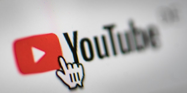 In this photo illustration the mouse cursor is pictured on the YouTube logo on March 26, 2019, in Berlin. 