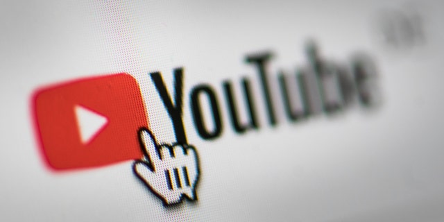 In this photo illustration the mouse cursor is pictured on the YouTube logo on March 26, 2019, in Berlin. 