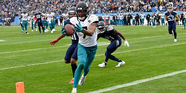 Jacksonville Jaguars wide receiver Zay Jones catches a touchdown pass against the Tennessee Titans Sunday, Dec. 11, 2022, in Nashville.