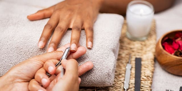 Some nail salons trim nail cuticles while others don't. Check your state's stance on cuticle cutting. In some places, the practice can be against the law. Customers usually have the choice of whether to have their cuticles trimmed or not.
