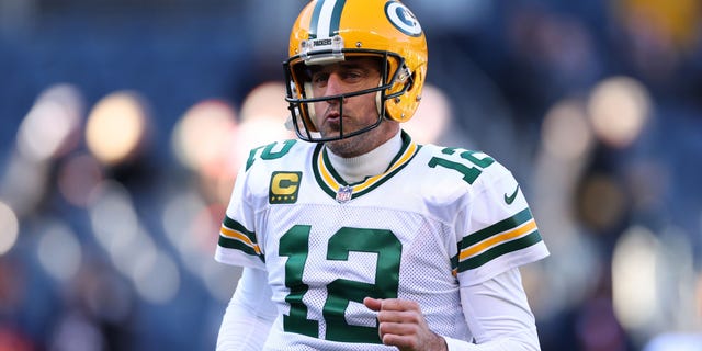Green Bay Packers number 12 Aaron Rodgers looks on before the game against the Chicago Bears at Soldier Field on December 4, 2022 in Chicago, Illinois.
