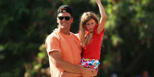 Pictured: Brady celebrates his Super Bowl win with the Tampa Bay Buccaneers with his daughter, Vivian Lake. She is the youngest of Brady’s three children.