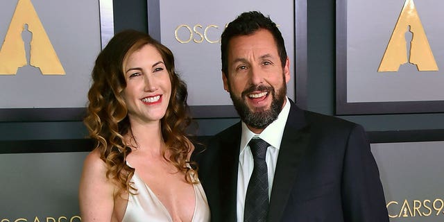 Adam Sandler, right, and his wife Jackie Sandler appear at the Governors Awards on Nov. 19, 2022, in Los Angeles, California.