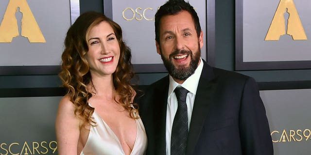 Adam Sandler, right, and his wife Jackie Sandler appear at the Governors Awards on Nov. 19, 2022, in Los Angeles, California.