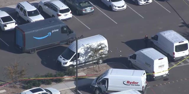 Arizona police say 29-year-old Jacob Murphy was killed by an armed Amazon employee when he opened fire in a parking lot 