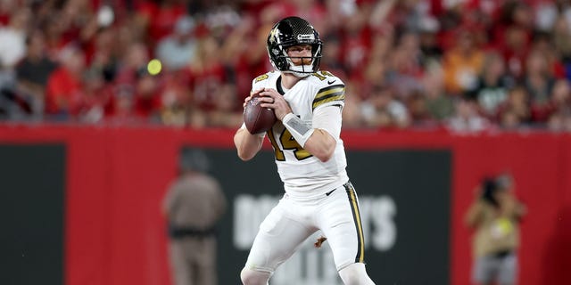Andy Dalton #14 of the New Orleans Saints looks to throw a pass against the Tampa Bay Buccaneers during the second quarter in the game at Raymond James Stadium on December 05, 2022 in Tampa, Florida.