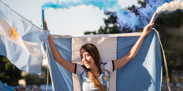 Fans of the Argentine national team in the city of Buenos Aires supporting their team the day of the Qatar 2022 FIFA World Cup final against the France national football team in front of the obelisk of Plaza de la Republica, Buenos Aires, Argentina on December 18, 2022.