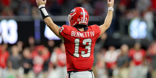 Stetson Bennett of the Georgia Bulldogs celebrates a touchdown against the LSU Tigers during the fourth quarter of the SEC championship game at Mercedes-Benz Stadium Dec. 3, 2022, in Atlanta.