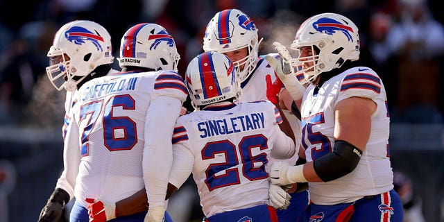 Devin Singletary #26 of the Buffalo Bills celebrates a touchdown during the third quarter in the game against the Chicago Bears at Soldier Field on December 24, 2022 in Chicago, Illinois. 