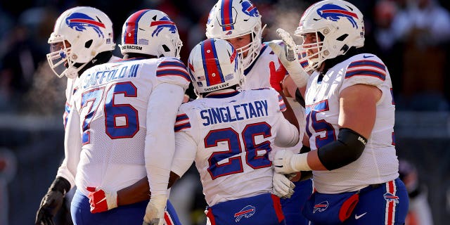 Devin Singletary #26 of the Buffalo Bills celebrates a touchdown during the third quarter in the game against the Chicago Bears at Soldier Field on Dec. 24, 2022 in Chicago, Ill. 