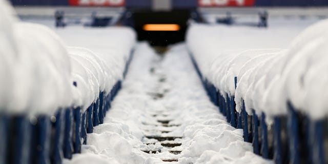 Snow covers seats and walkways at Highmark Stadium prior to a game between the Miami Dolphins and the Buffalo Bills Dec. 17, 2022, in Orchard Park, N.Y.